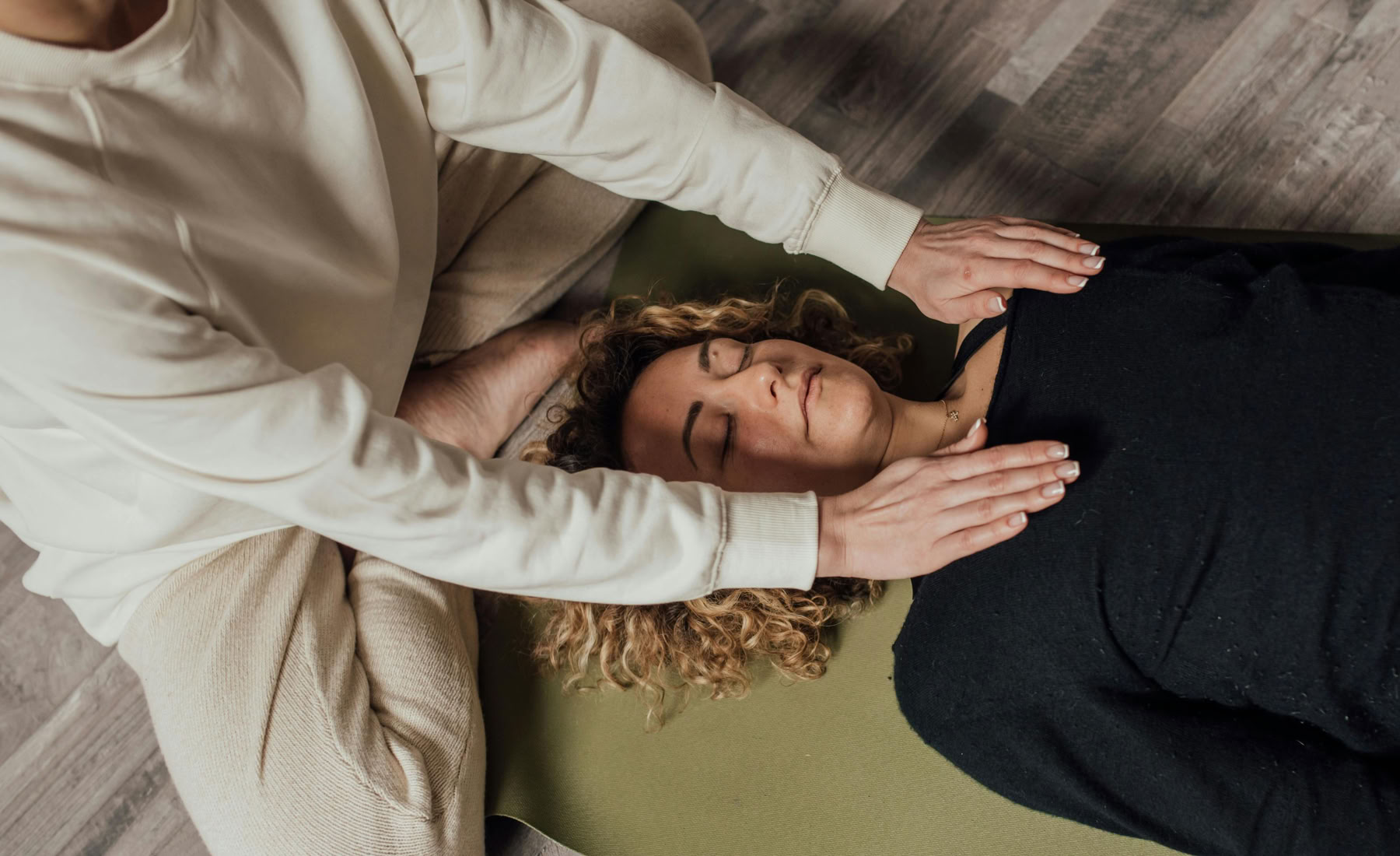 Reiki II in action with hands hovering above the body